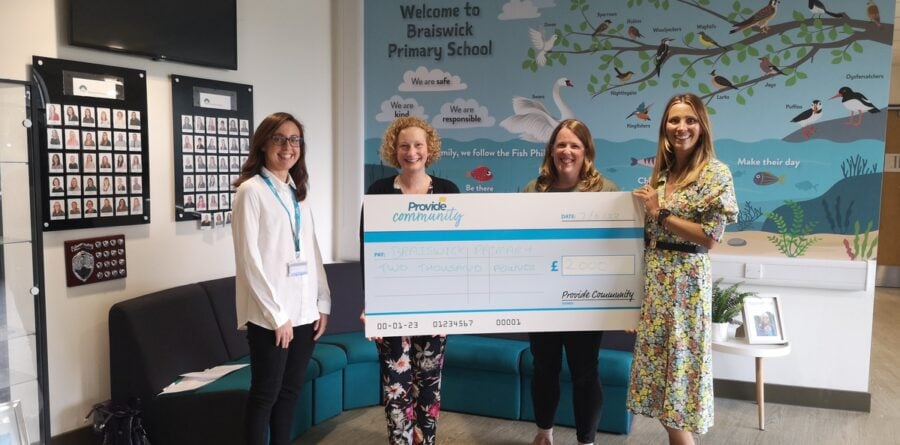 Colchester primary school welcomes £2000 charity cheque from Provide Community